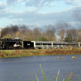 Engine 819 steams past a picturesque lake on the way to St. Louis, Missouri.